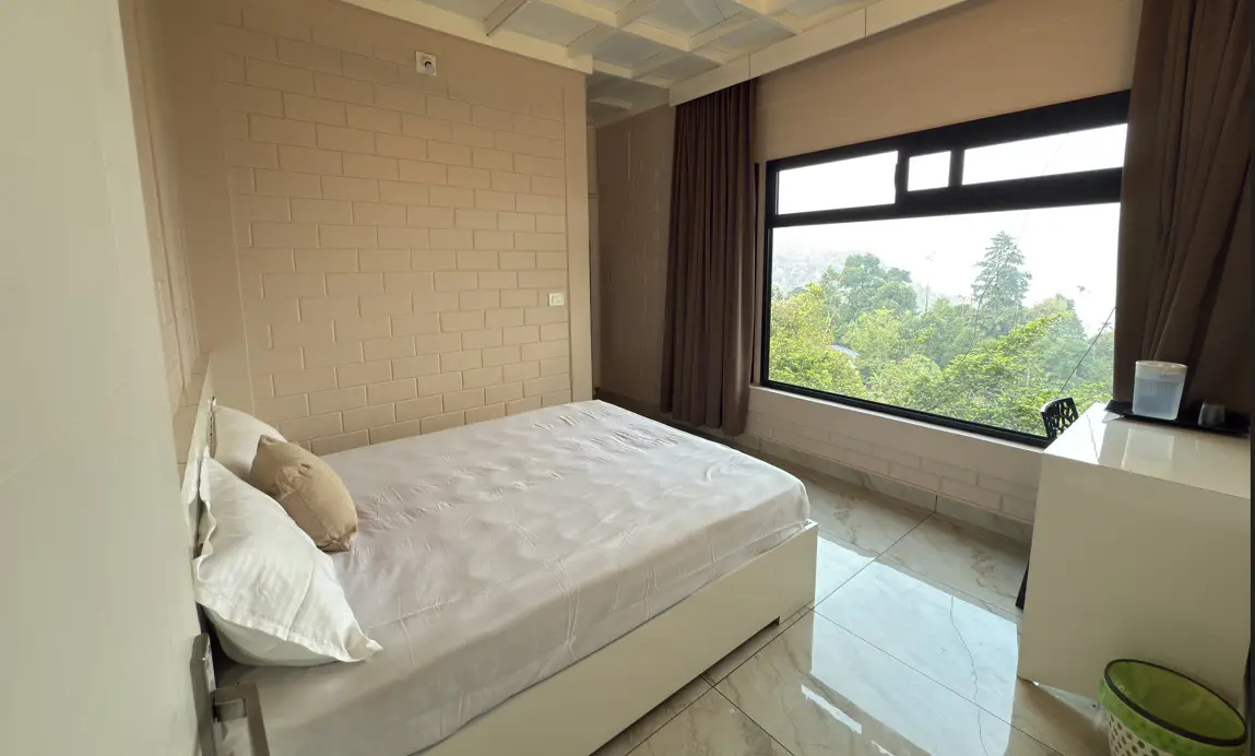Comfortable guest room with mountain view window