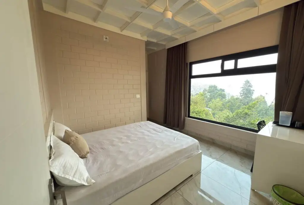 Comfortable guest room with mountain view window