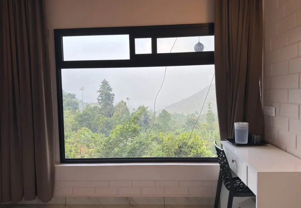 Comfortable guest room with mountain view window