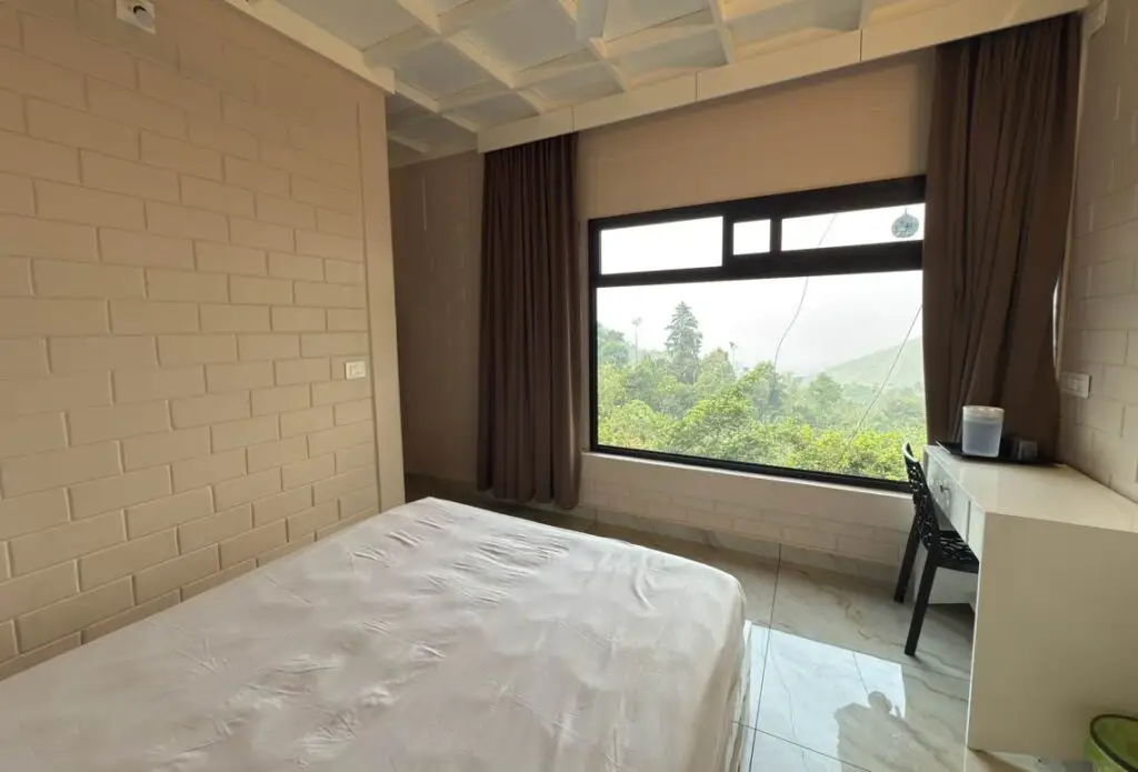 Comfortable guest room with mountain view window