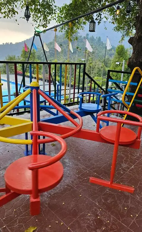 Outdoor swing set at Mount 360 Degree Resort, Poovaranthode, Kerala