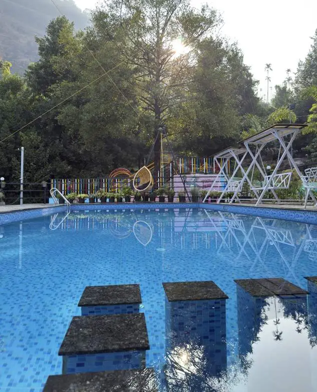 Swimming pool with kids area at Mount 360 Resort, malabar, Kerala