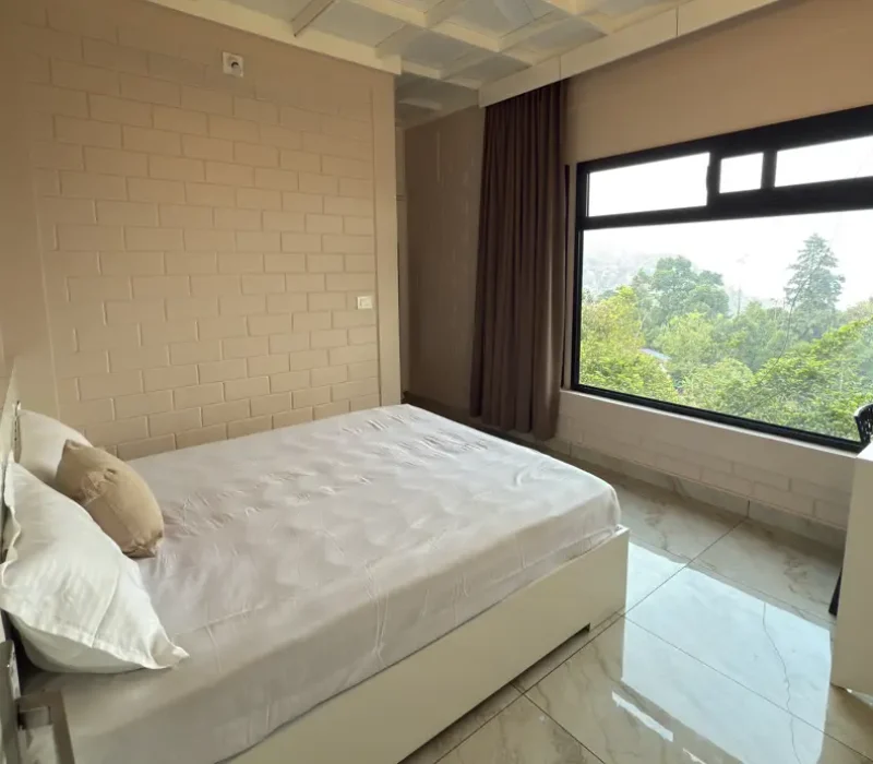 Comfortable guest room with mountain view window