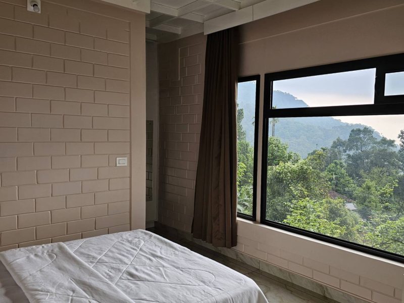 Comfortable guest room with mountain view window